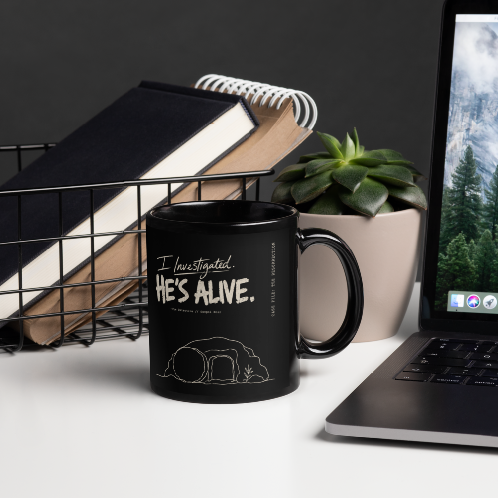 I Investigated. He’s Alive. Black Christian Mug – 11 oz — black, right handle on right. Gospel Noir Christian coffee mug by Heavenly Crafted, Christmas Christian gift