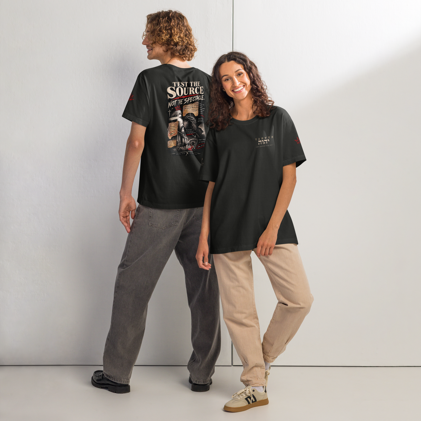 Test the Source Not the Spectacle oversized Christian discernment T-shirt with Gospel Noir source-verification design.