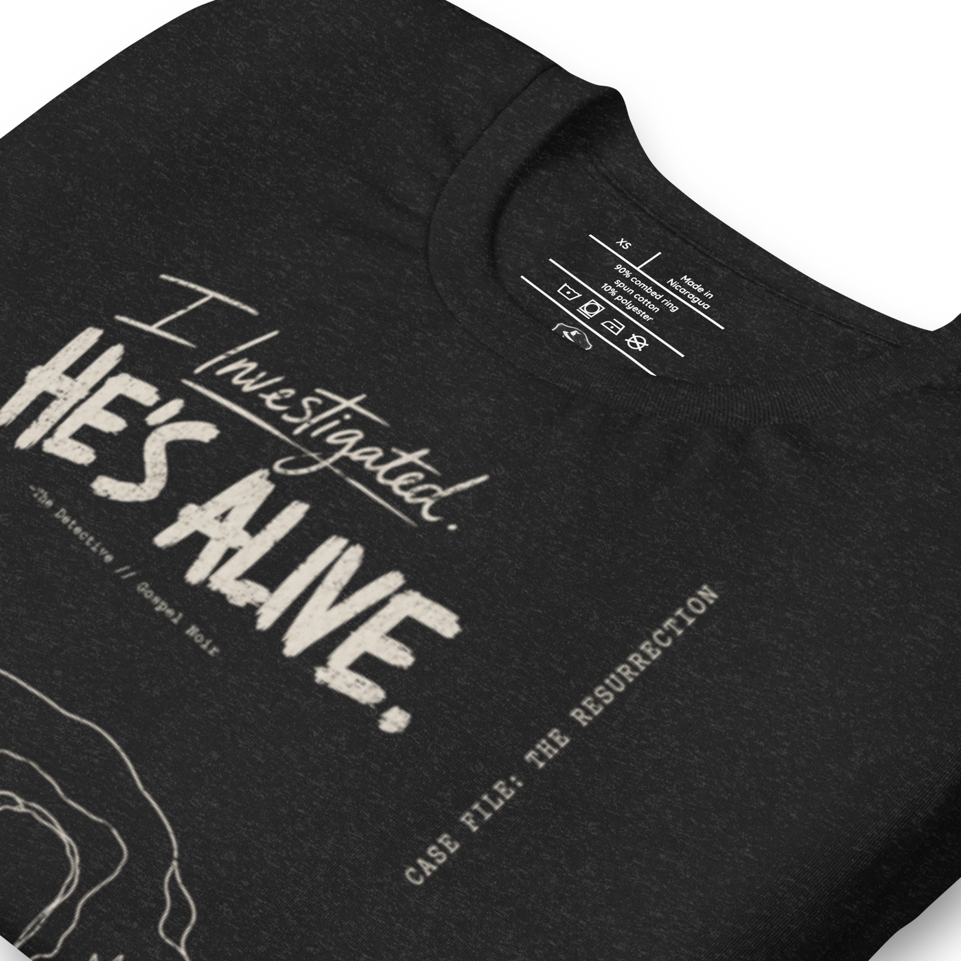 I Investigated. He’s Alive. Christian T-Shirt — black, label and care detail