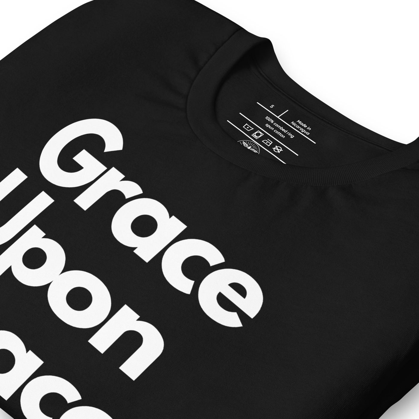 Grace Upon Grace John 1:16 Black Christian T-Shirt — black, label and care detail 2