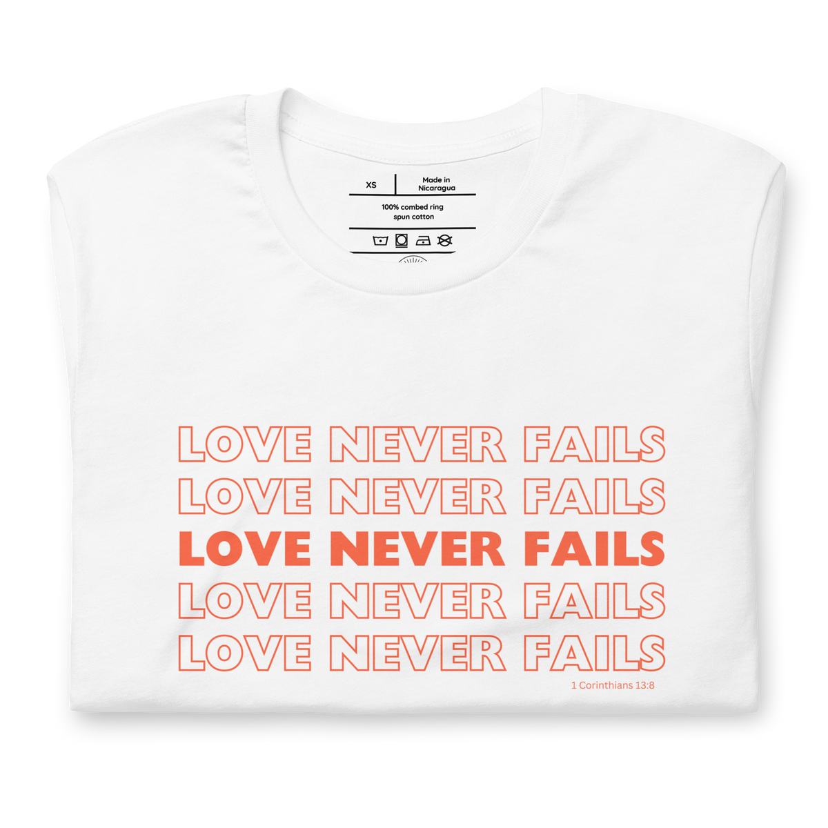 Love Never Fails 1 Corinthians 13:8 Christian T-Shirt — white, folded view