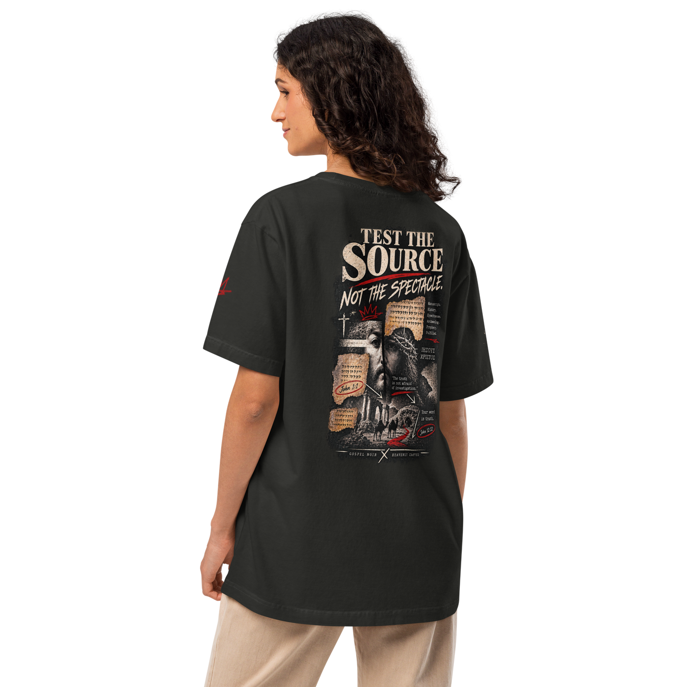 Test the Source Not the Spectacle oversized Christian discernment T-shirt with Gospel Noir source-verification design.