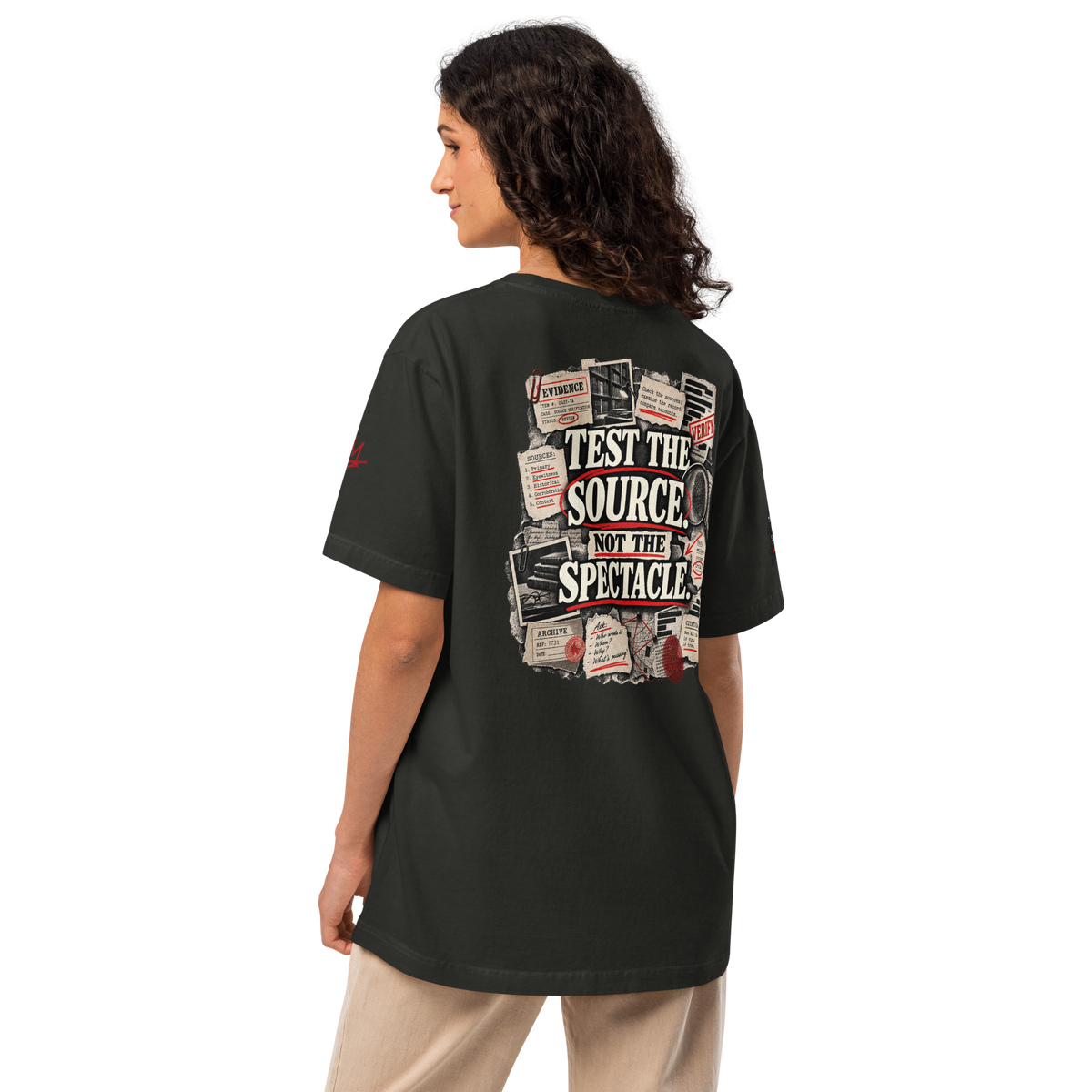 Test the Source Not the Spectacle II oversized Christian discernment T-shirt with Gospel Noir source-verification design.