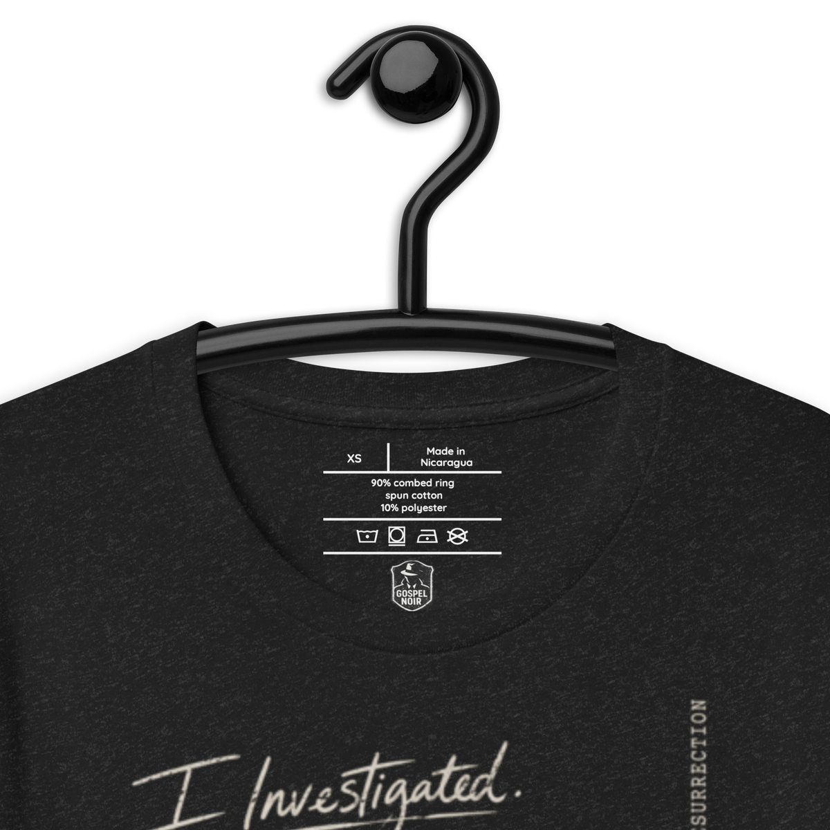 I Investigated. He’s Alive. Christian T-Shirt — black, label and care detail 2
