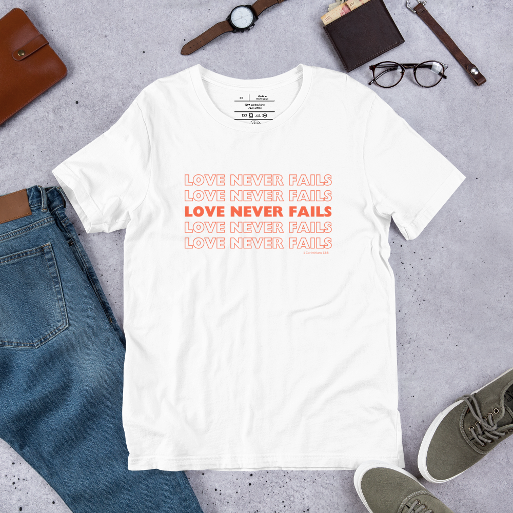 Love Never Fails 1 Corinthians 13:8 Christian T-Shirt — white, lifestyle view